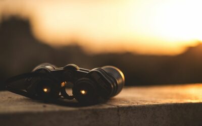 Benefits of Focusing on God - Haly Ministries (on photo: binoculars focusing on sunset)