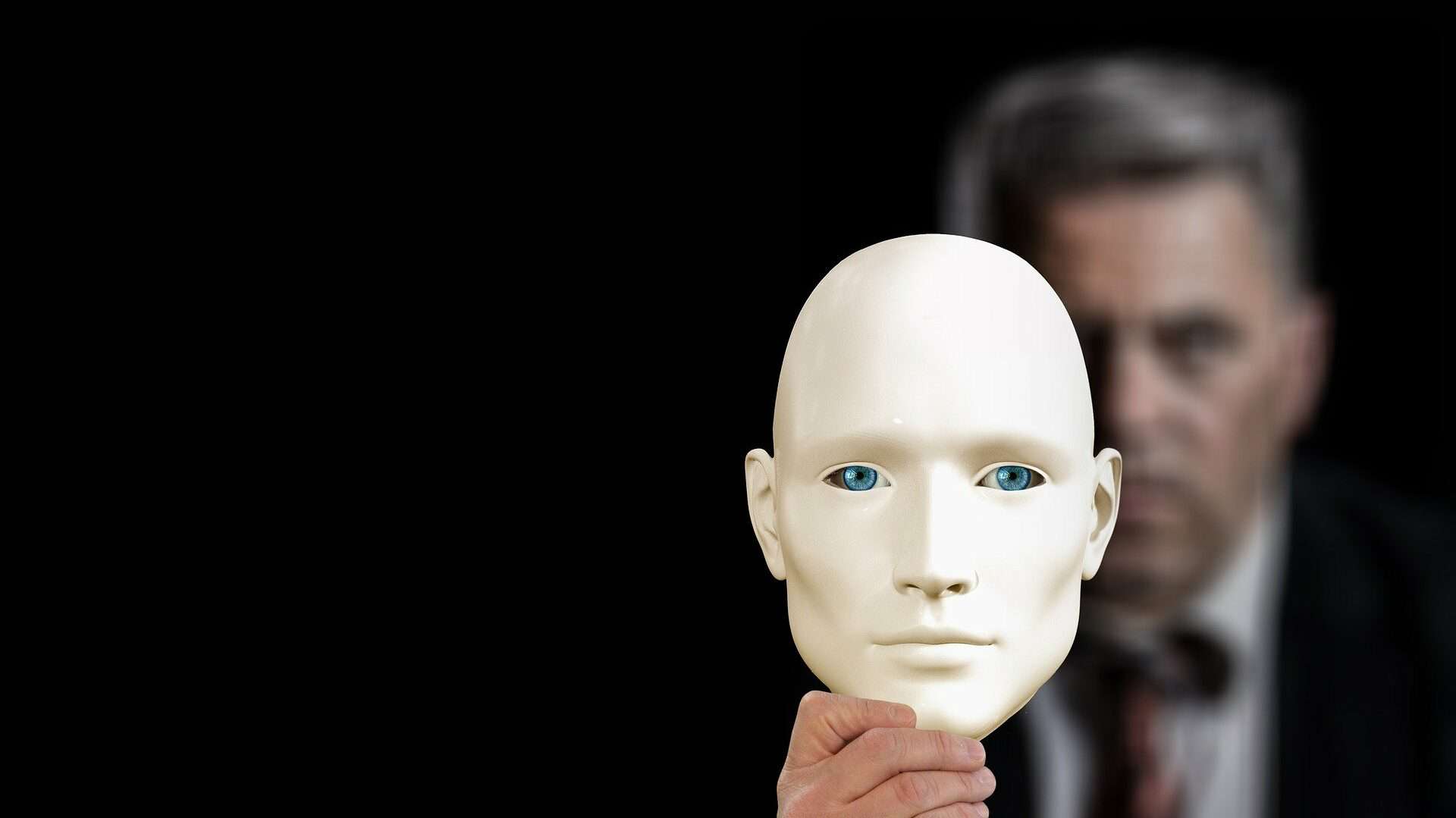 Businessman Holding Mask