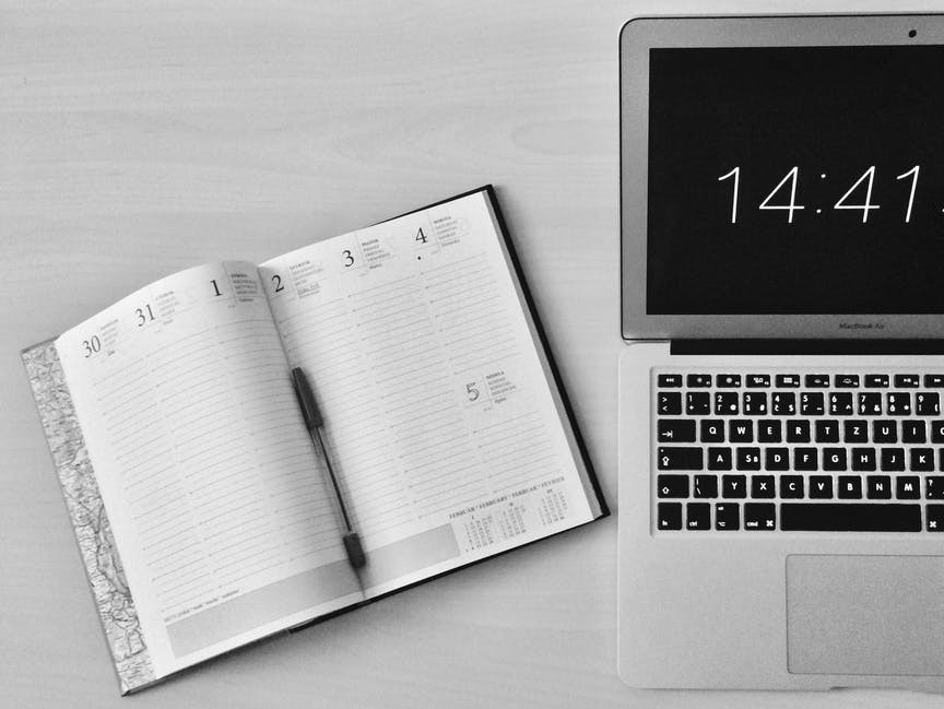 Day Planner and Laptop on the Desk