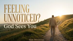 Man walking uphill alone through a field, representing a hidden season and the reminder that God sees you