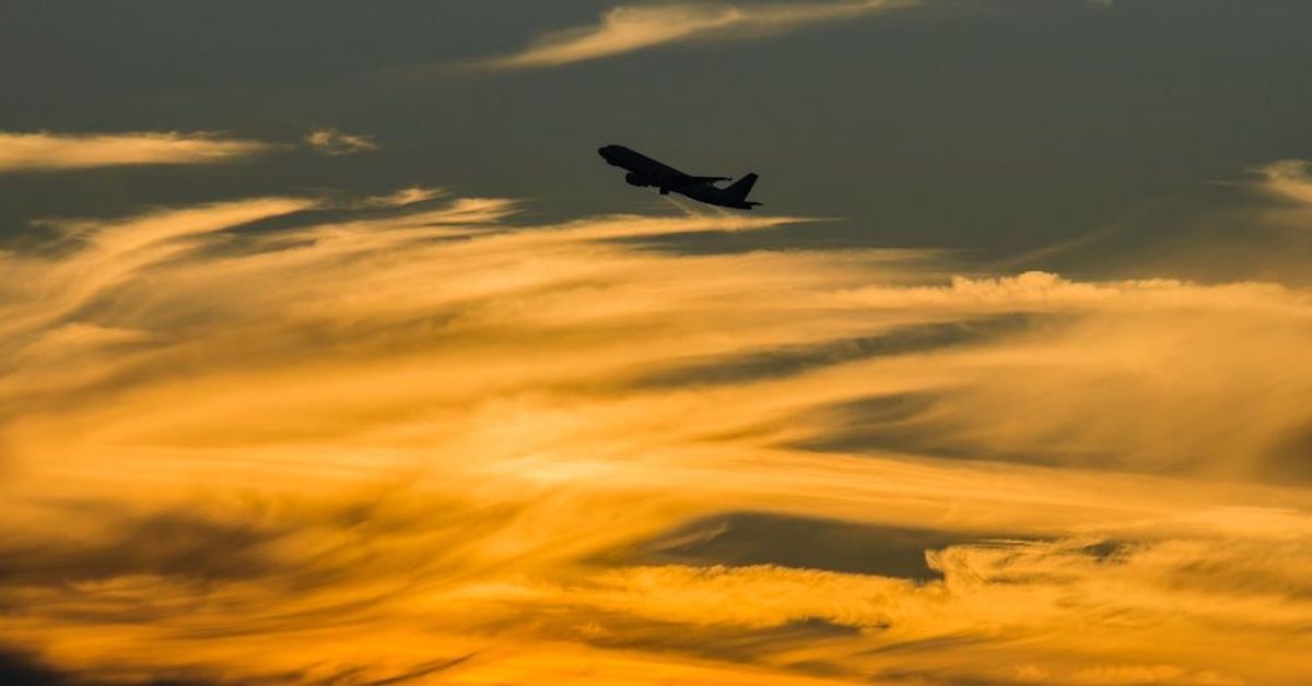 God is Calling Us Higher: We are Moving to the Next Level (on photo: a plane in the sky with orange rays)