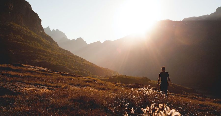 How to Experience God's Comfort in Every Season of Life - Haly Ministries (on photo: mountains landscape and man walking)