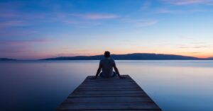 How to Wait Upon the Lord Patience Trust and Faith - Haly Ministries (man sitting on dock)