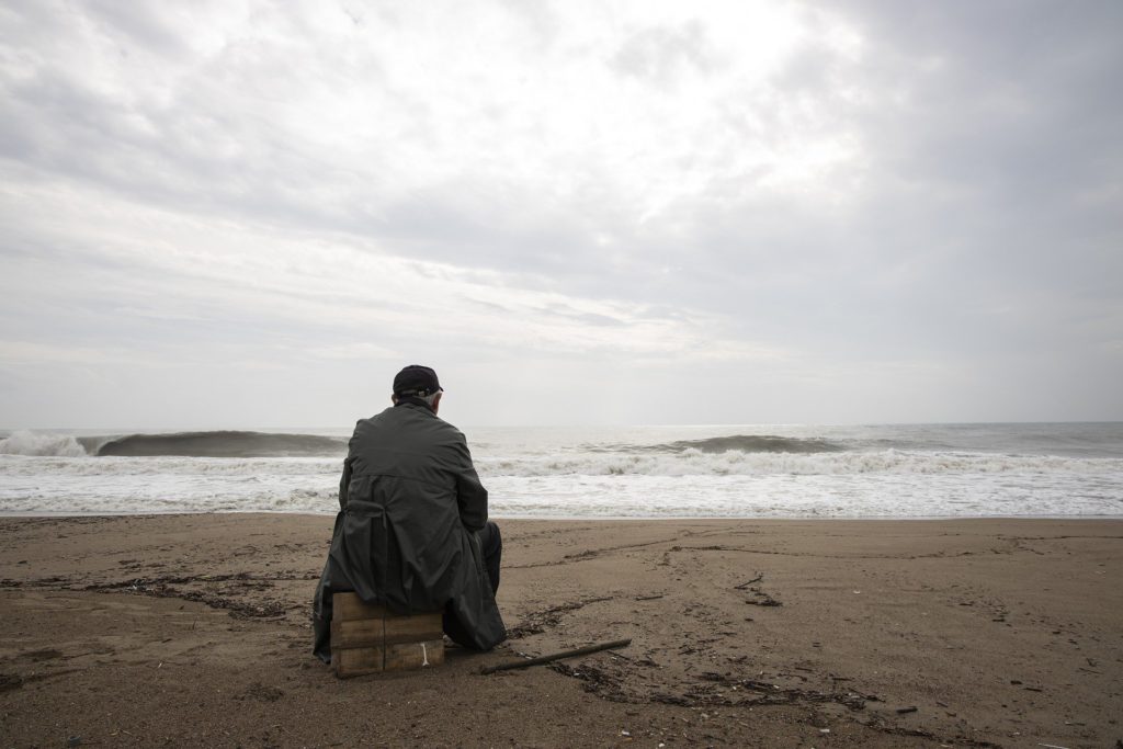 Man Meditating  - Looking at the Sea