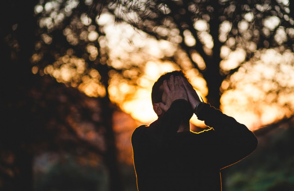 Man is Disappointed Closed his Face with Hands