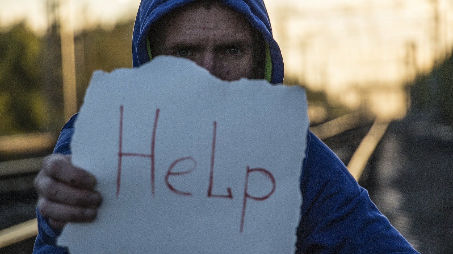 Man with Help Sign