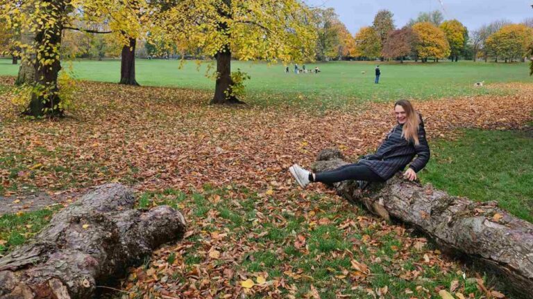 London Park Woman Sitting on the Log
