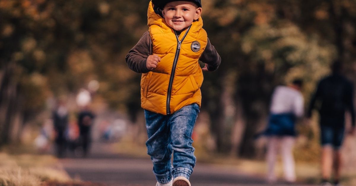 The Benefits and Results of Walking with God - Haly Ministries (on photo: a boy running in yellow jacket)