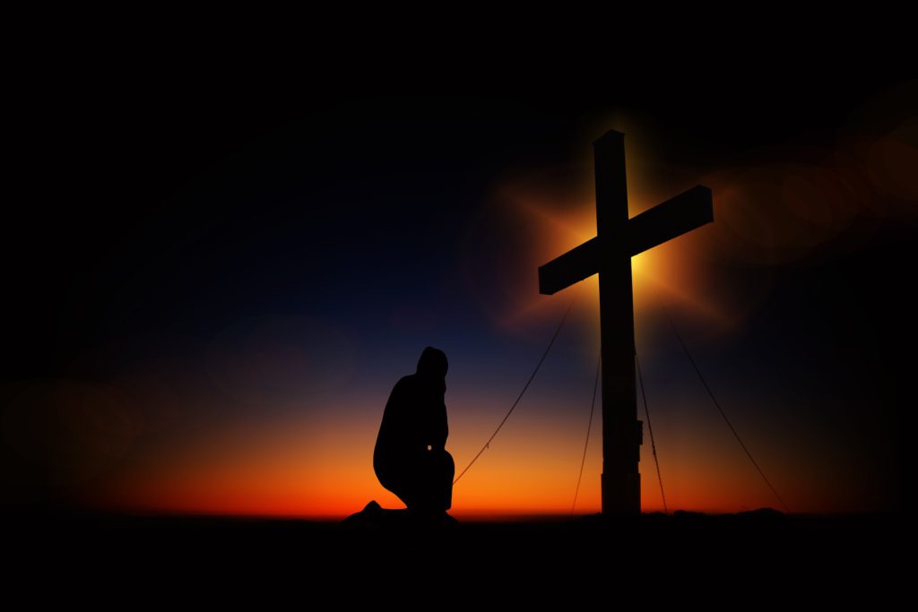 The Cross - Man Kneels Down