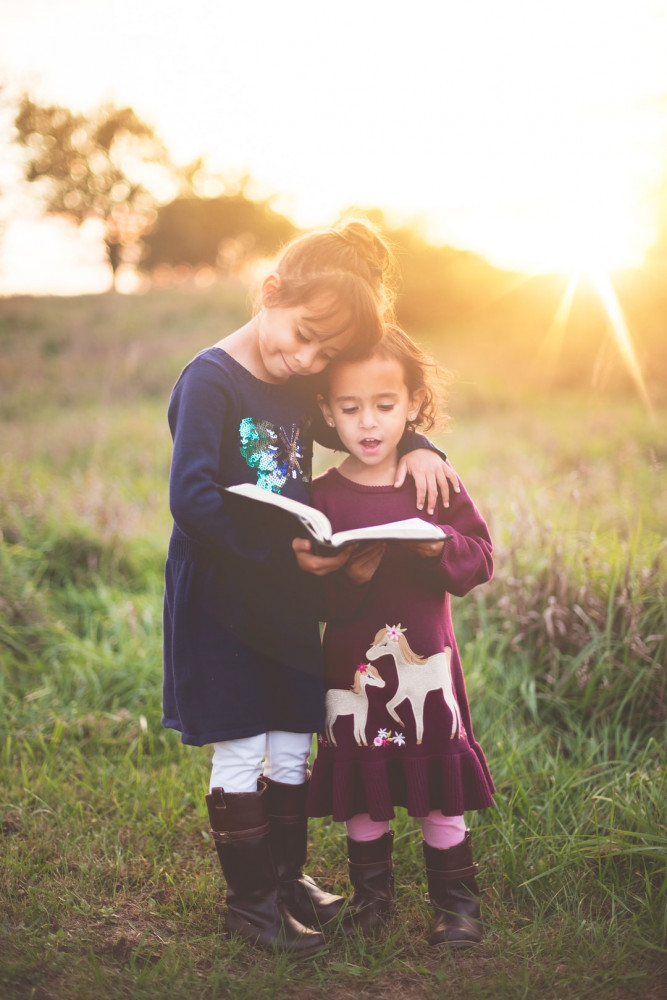 Two Girls Reading the Bible