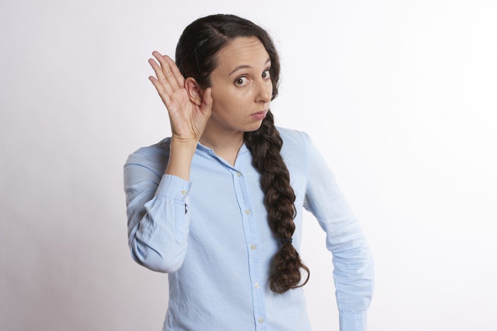 Woman Put Her Hand To Her Ear