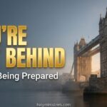 Tower Bridge in London shrouded in soft morning mist with golden sunlight breaking through, featuring bold gold text that reads "YOU'RE NOT BEHIND" and white text below "You're Being Prepared" with halyministries.com centered at the bottom.
