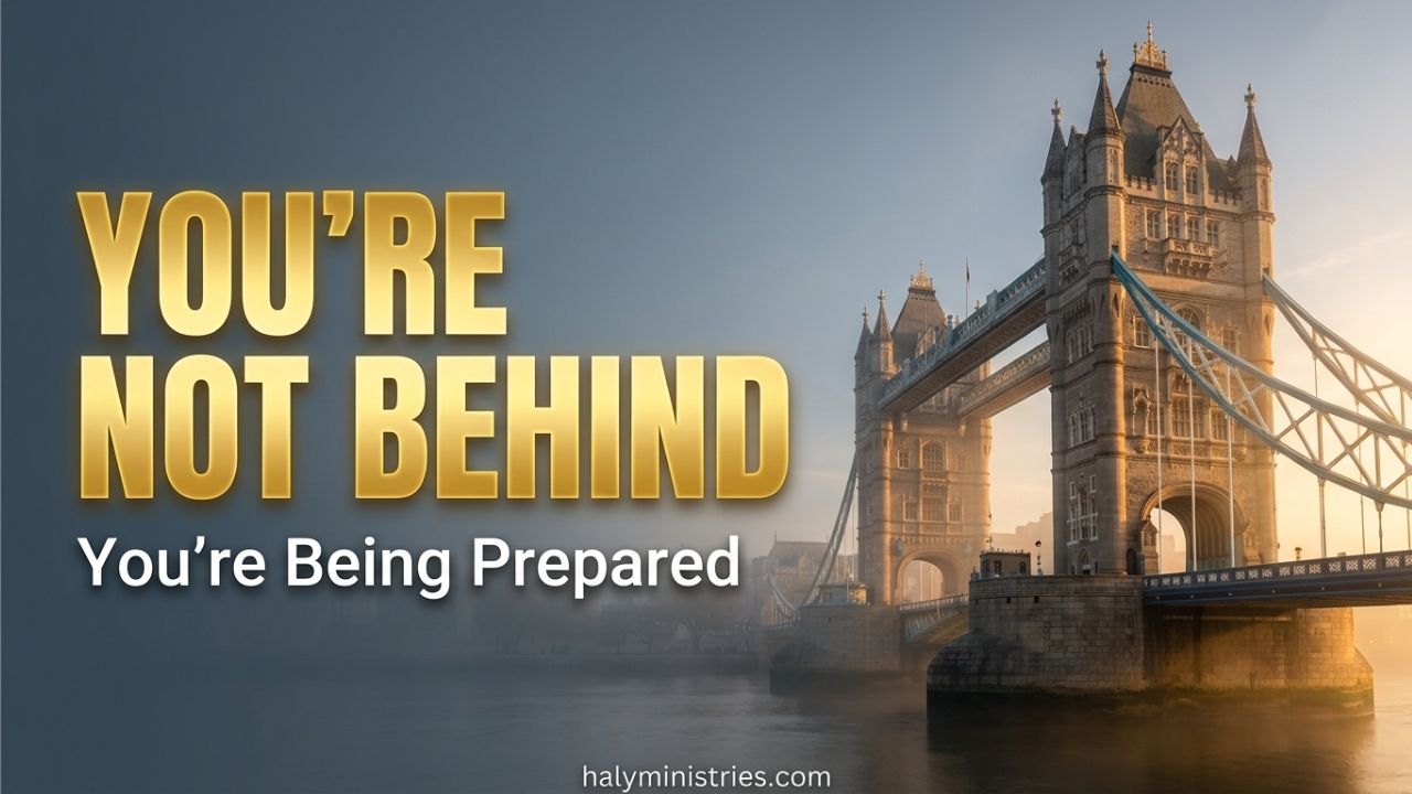 Tower Bridge in London shrouded in soft morning mist with golden sunlight breaking through, featuring bold gold text that reads "YOU'RE NOT BEHIND" and white text below "You're Being Prepared" with halyministries.com centered at the bottom.