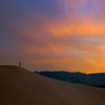 A valley landscape at dawn representing the dry bones vision of Ezekiel 37 and God's prophetic word of restoration through Haly Ministries